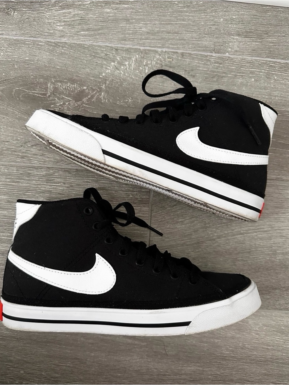 Black and white nike legacy mid canvas.